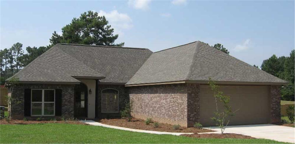 This image is a colored photo of the front of these House Plans.