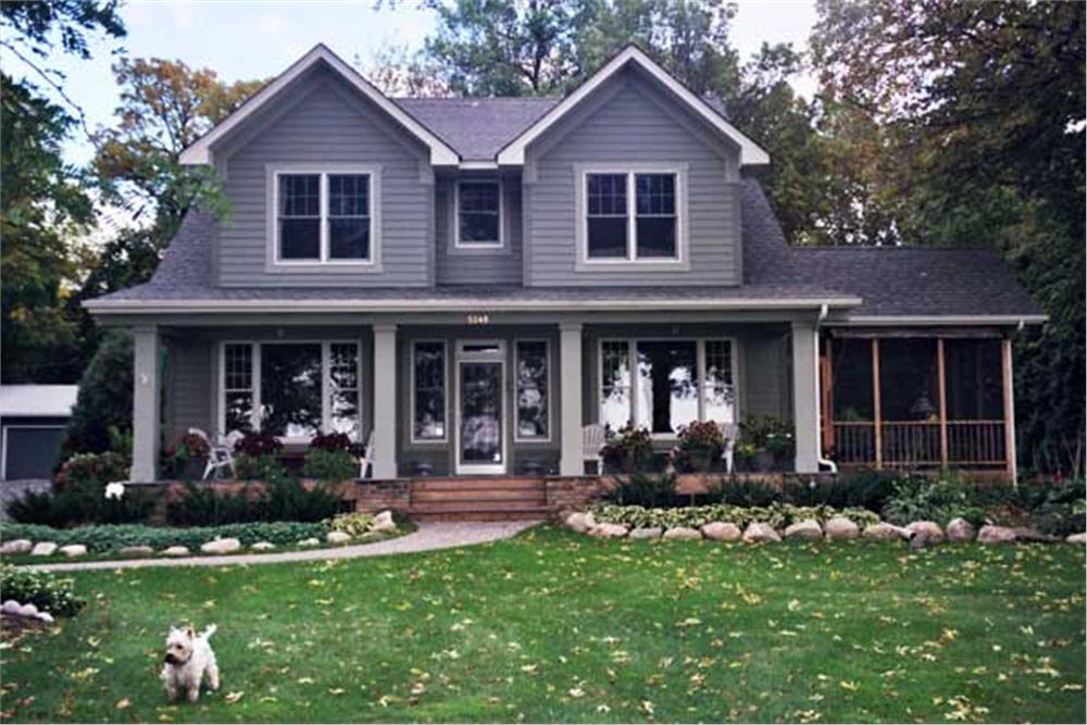 Elevation photo of Country House Plans CLS-3215 with a cute little dog.