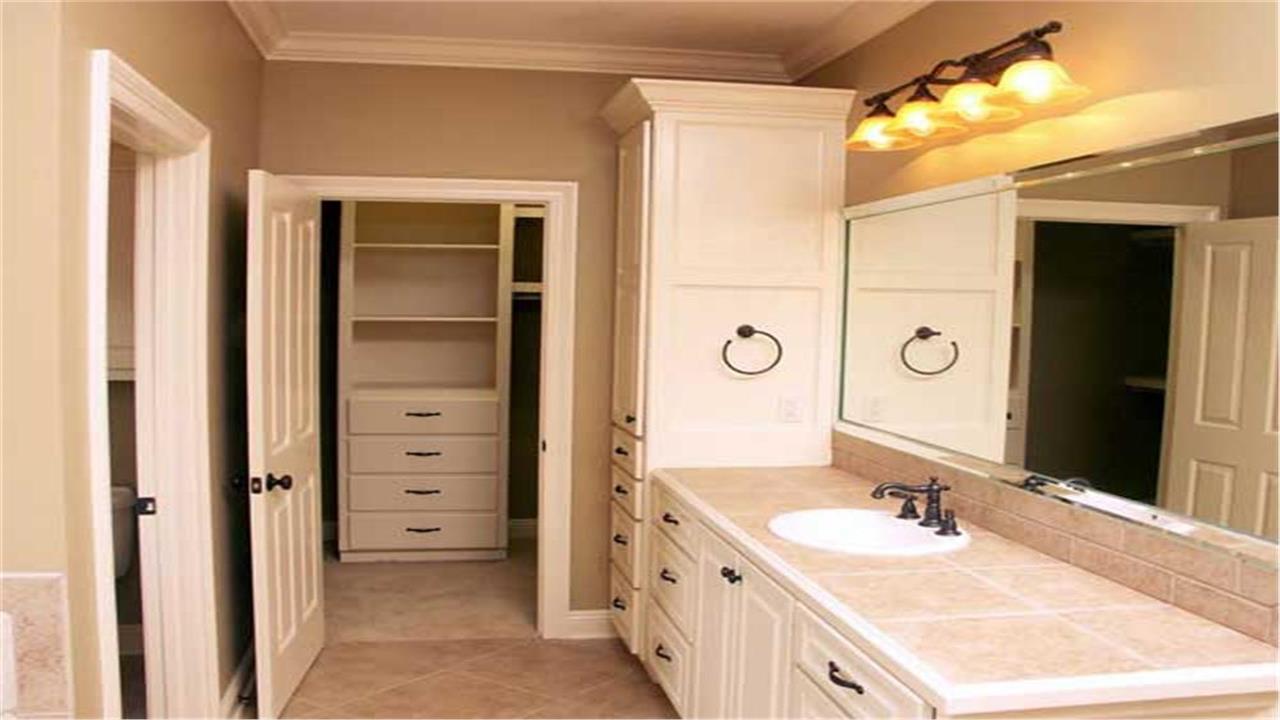Photo of a walk-in closet off of a bathroom (Plan #141-1072)