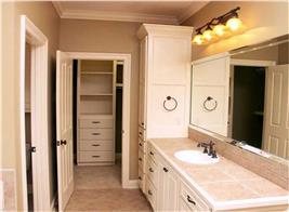 Photo of a walk-in closet off of a bathroom (Plan #141-1072)