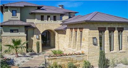 One story home designed in the Southwest style featuring 5 bedrooms and 3 baths.